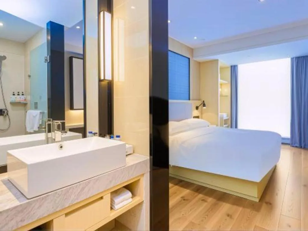 Bed in Echarm Hotel Aegean Shopping Park Zhonghuan Plaza