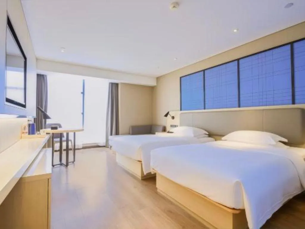 Bed in Echarm Hotel Aegean Shopping Park Zhonghuan Plaza