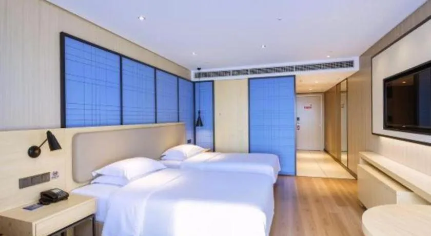 Bed in Echarm Hotel Aegean Shopping Park Zhonghuan Plaza