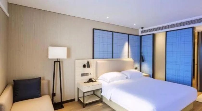 Bed in Echarm Hotel Aegean Shopping Park Zhonghuan Plaza