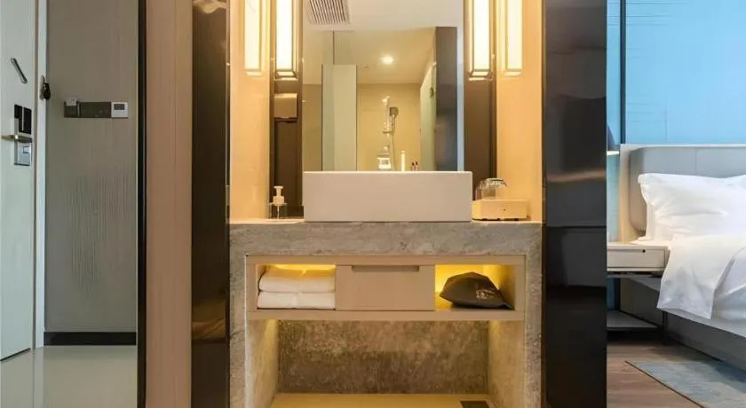 Bed in Echarm Hotel Aegean Shopping Park Zhonghuan Plaza