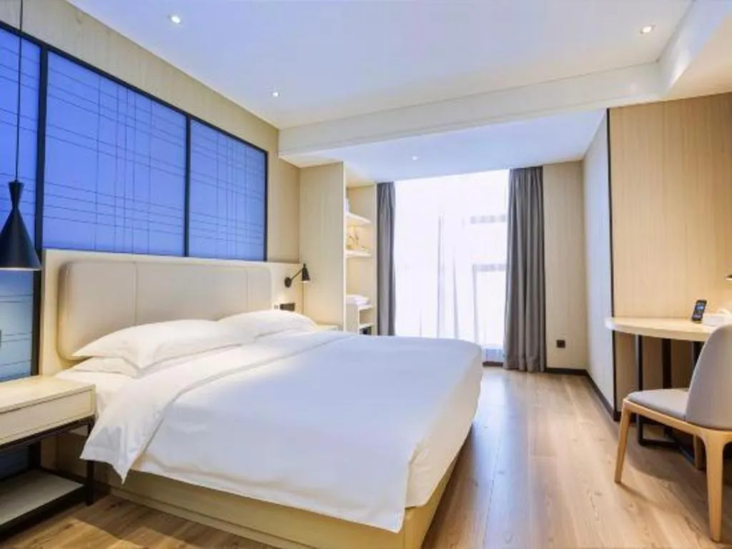 Bed in Echarm Hotel Aegean Shopping Park Zhonghuan Plaza