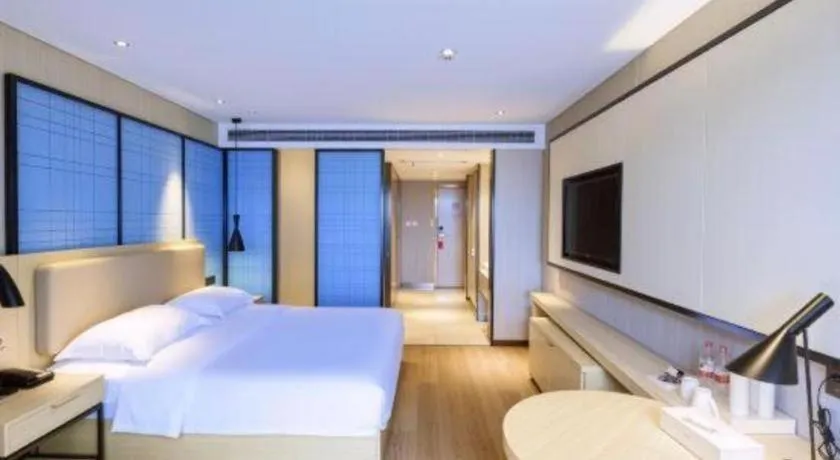 Bed in Echarm Hotel Aegean Shopping Park Zhonghuan Plaza