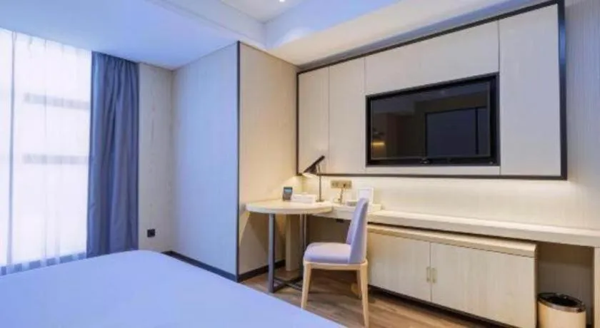 Bed in Echarm Hotel Aegean Shopping Park Zhonghuan Plaza