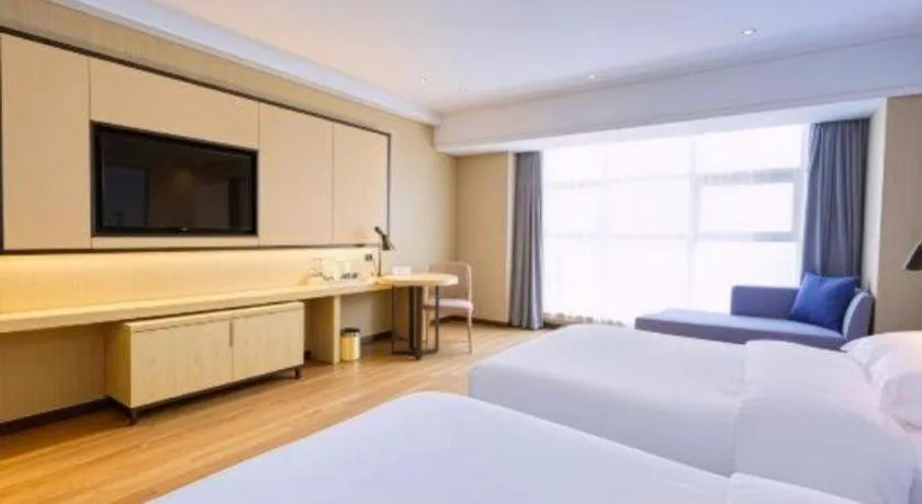 Bed in Echarm Hotel Aegean Shopping Park Zhonghuan Plaza