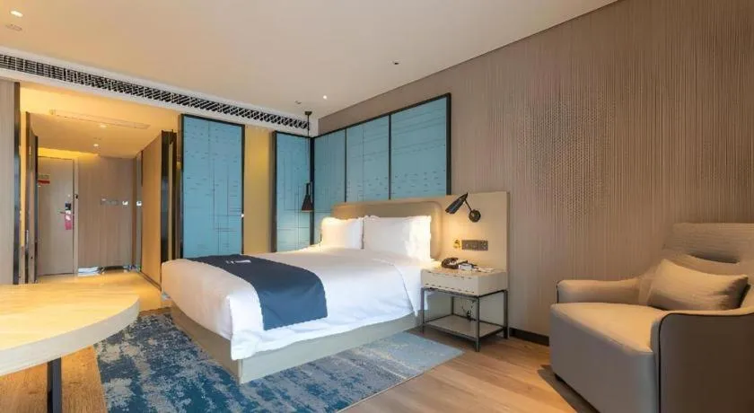 Bed in Echarm Hotel Aegean Shopping Park Zhonghuan Plaza