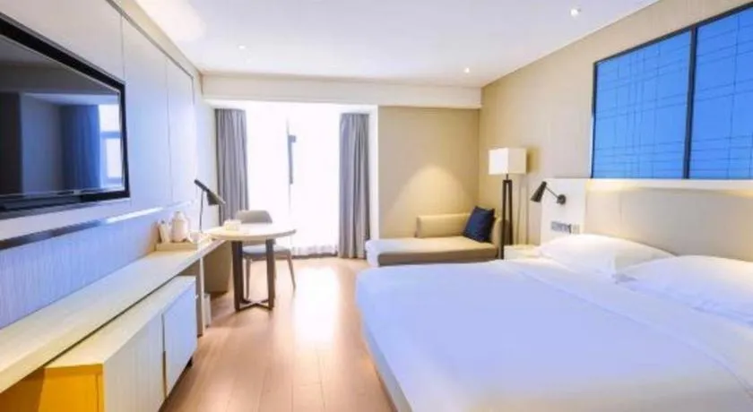 Bed in Echarm Hotel Aegean Shopping Park Zhonghuan Plaza