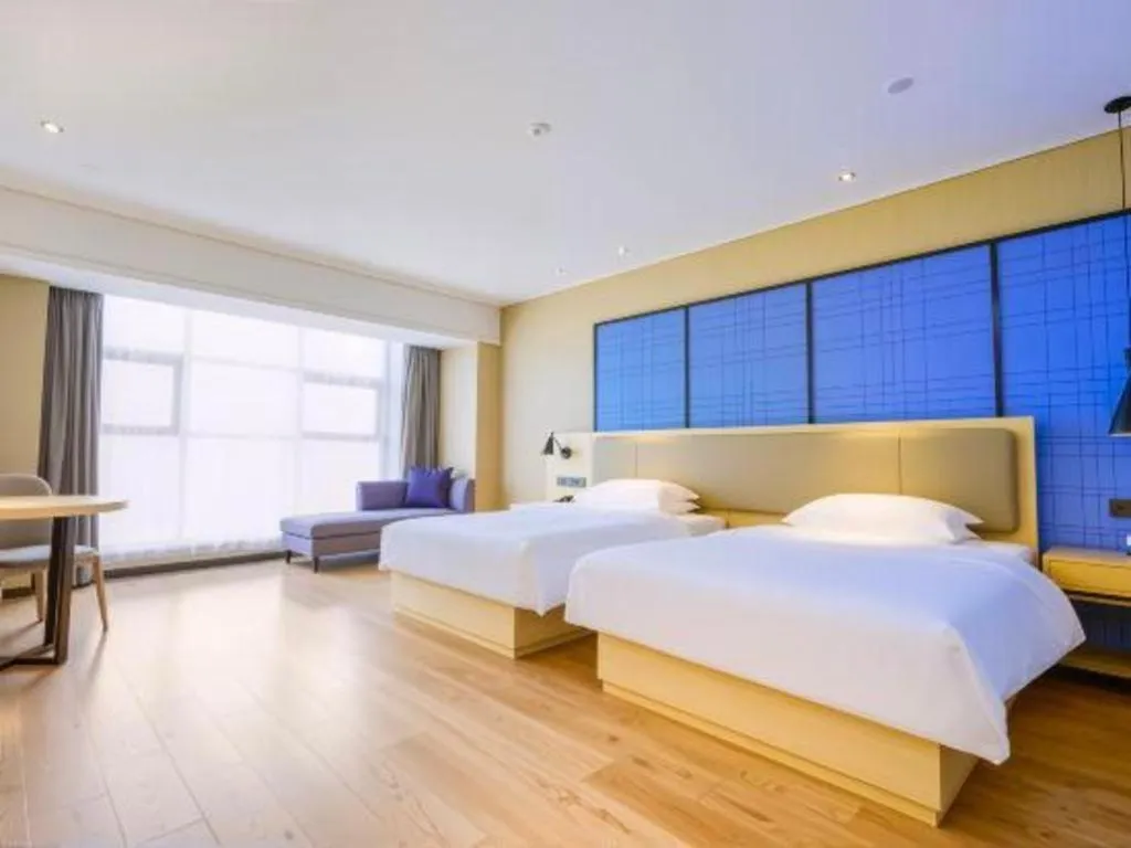 Bed in Echarm Hotel Aegean Shopping Park Zhonghuan Plaza