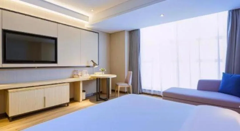 Bed in Echarm Hotel Aegean Shopping Park Zhonghuan Plaza