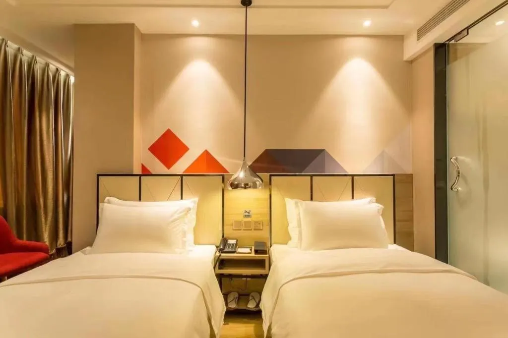 Bed in Borrman Hotel Tai'an Central Hospital Taishan Tianwai Village Hongmen