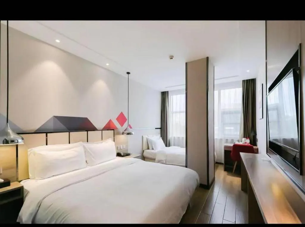 Bed in Borrman Hotel Tai'an Central Hospital Taishan Tianwai Village Hongmen