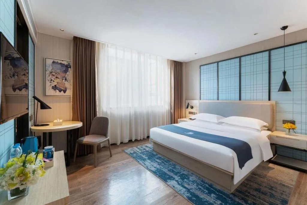 Bed in Echarm Hotel Guangzhou Changlong Shiqiao Metro Station