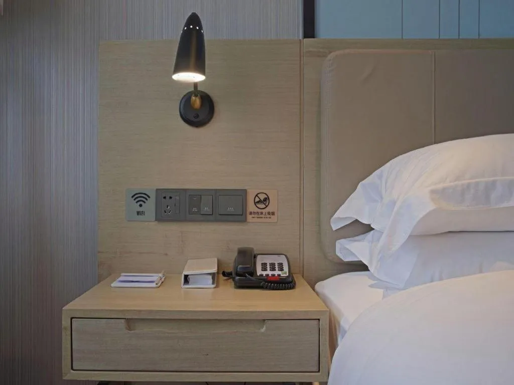 Bed in Echarm Hotel Guangzhou Changlong Shiqiao Metro Station