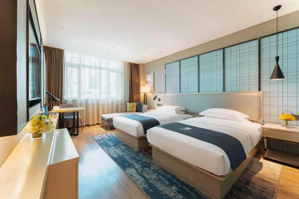 Bed in Echarm Hotel Guangzhou Changlong Shiqiao Metro Station