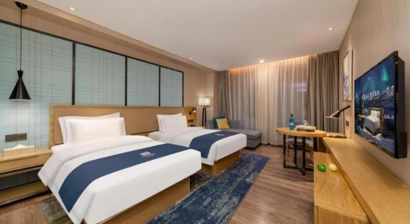 Bed in Echarm Hotel Guangzhou Tonghe Dayuan Times Square