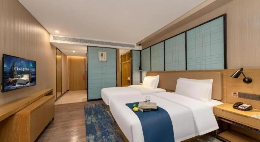 Bed in Echarm Hotel Guangzhou Tonghe Dayuan Times Square