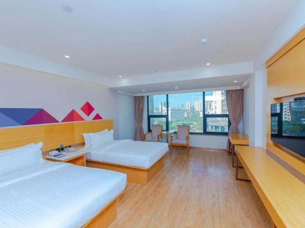 Bed in Borrman Hotel Zhanjiang Shimao Building High-speed Railway Station