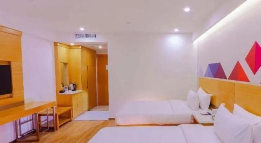 Bed in Borrman Hotel Zhanjiang Shimao Building High-speed Railway Station