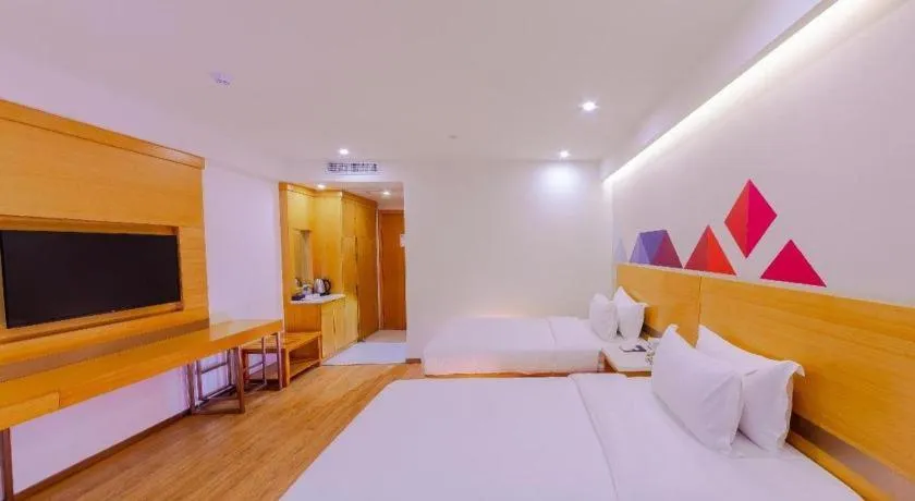 Bed in Borrman Hotel Zhanjiang Shimao Building High-speed Railway Station