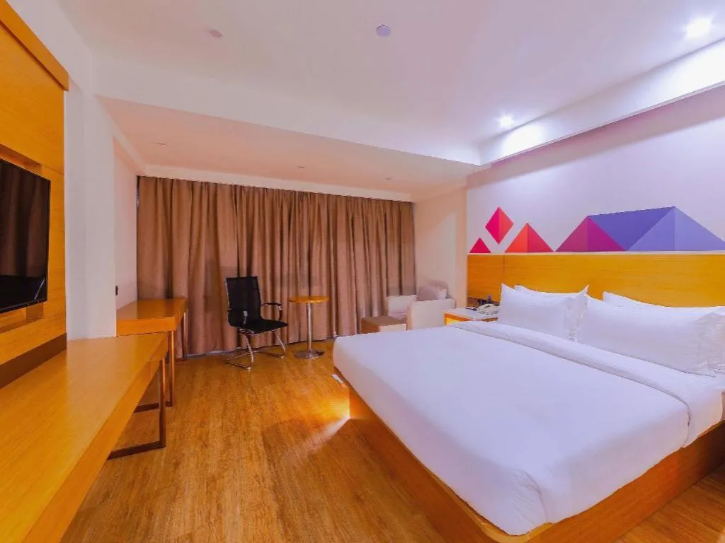 Bed in Borrman Hotel Zhanjiang Shimao Building High-speed Railway Station