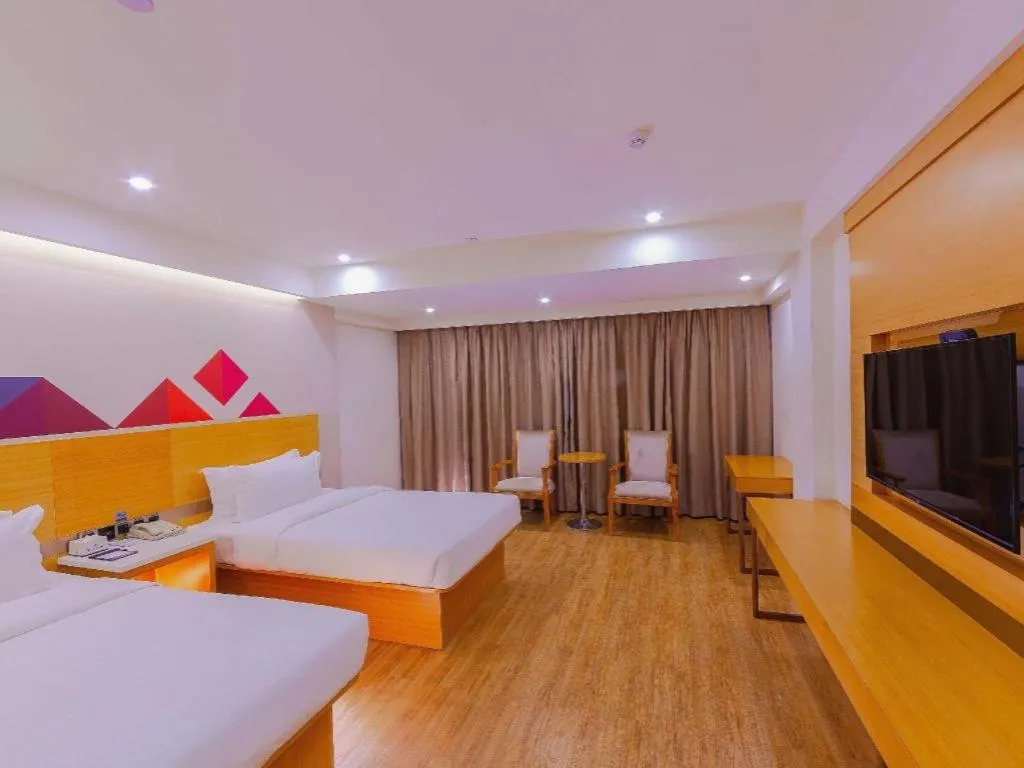 Bed in Borrman Hotel Zhanjiang Shimao Building High-speed Railway Station