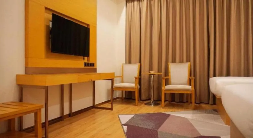 Bed in Borrman Hotel Zhanjiang Shimao Building High-speed Railway Station