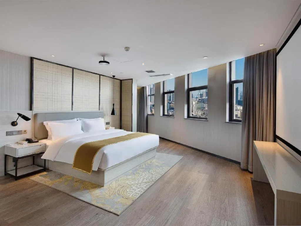 Bed in Echarm Hotel Changsha Guihua Park Metro Station