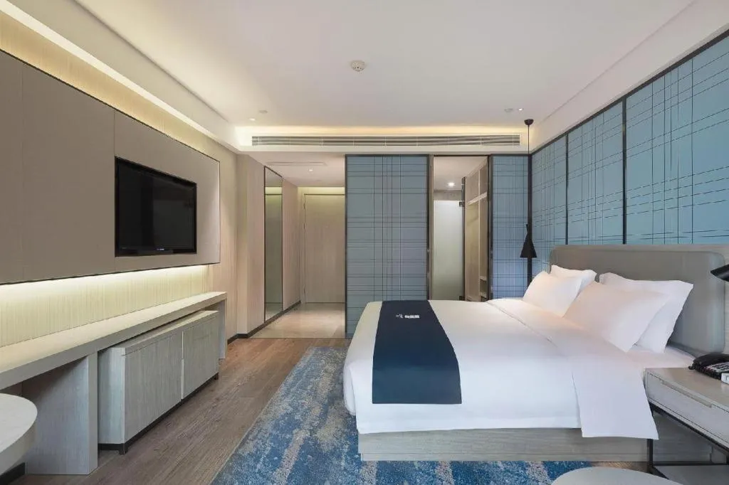 Bed in Echarm Hotel Changsha Guihua Park Metro Station