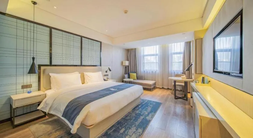 Bed in Echarm Hotel Changsha Guihua Park Metro Station