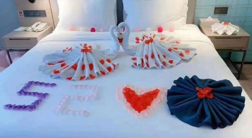 Bed in Echarm Hotel Changsha Guihua Park Metro Station