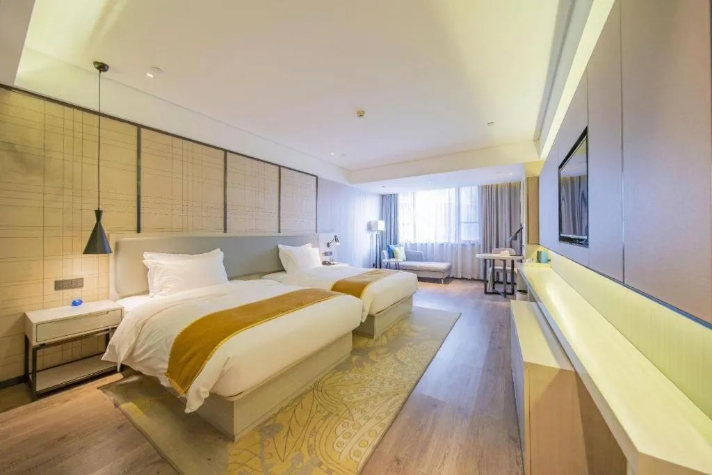 Bed in Echarm Hotel Changsha Guihua Park Metro Station