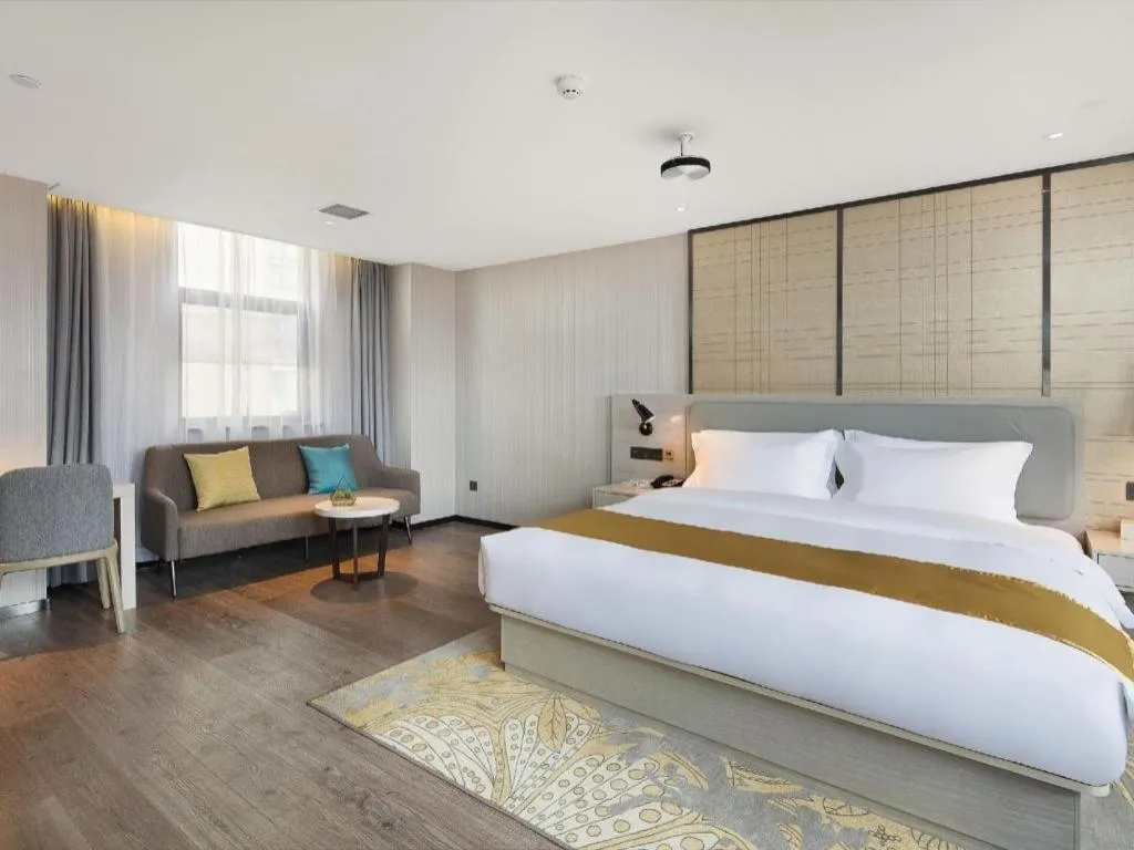 Bed in Echarm Hotel Changsha Guihua Park Metro Station