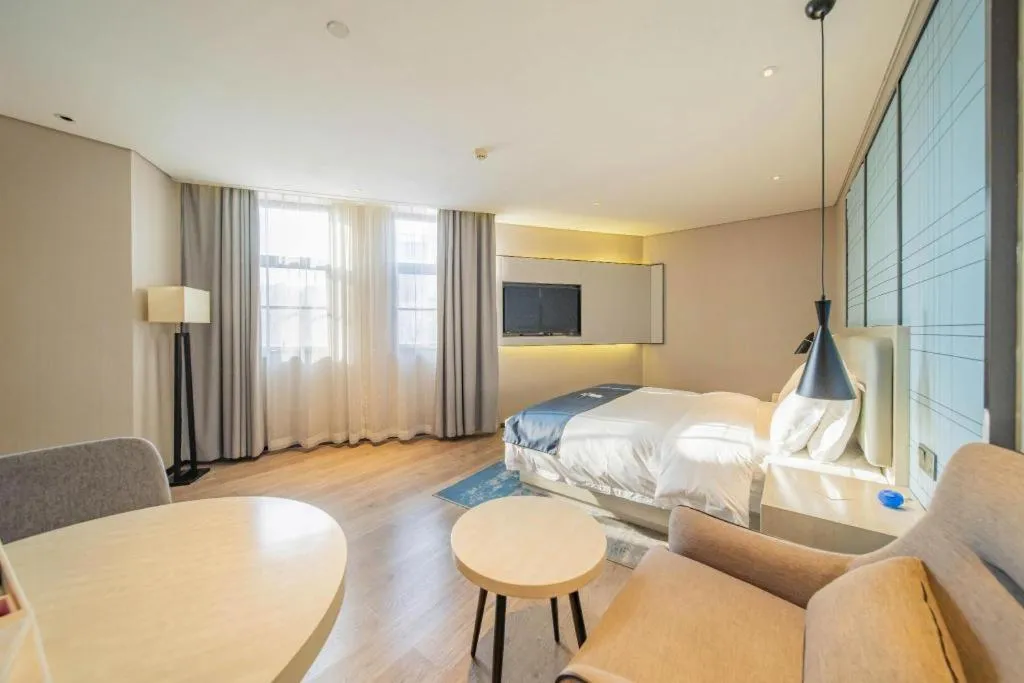 Bed in Echarm Hotel Changsha Guihua Park Metro Station