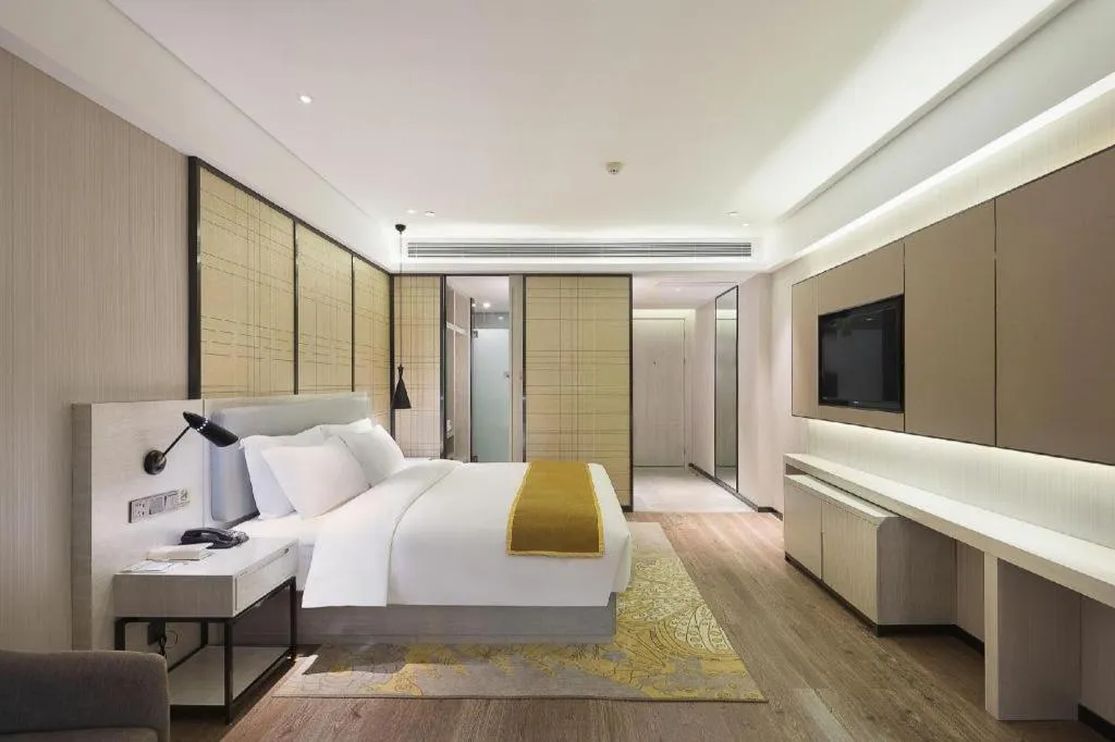 Bed in Echarm Hotel Changsha Guihua Park Metro Station