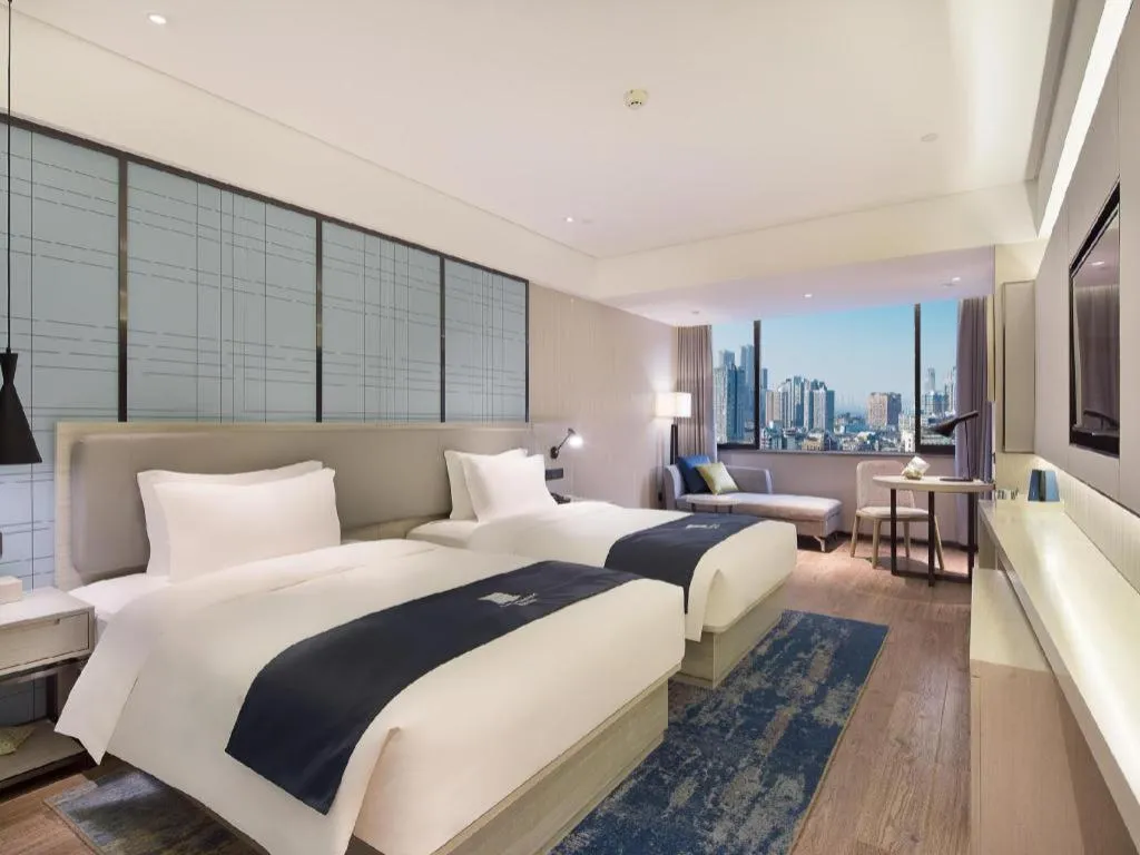 Bed in Echarm Hotel Changsha Guihua Park Metro Station