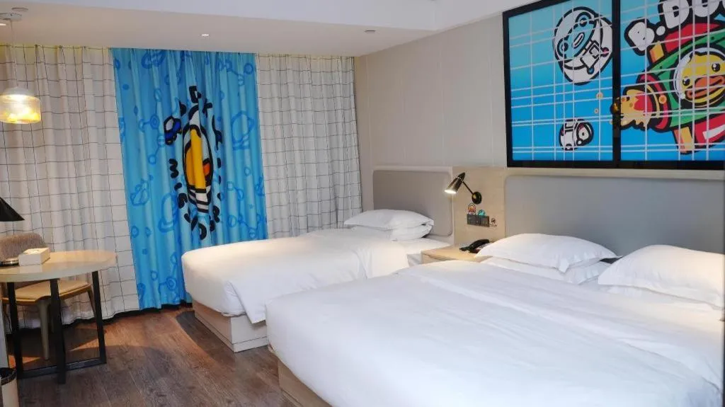 Bed in Echarm Hotel Changsha Guihua Park Metro Station