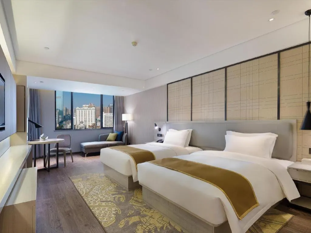 Bed in Echarm Hotel Changsha Guihua Park Metro Station