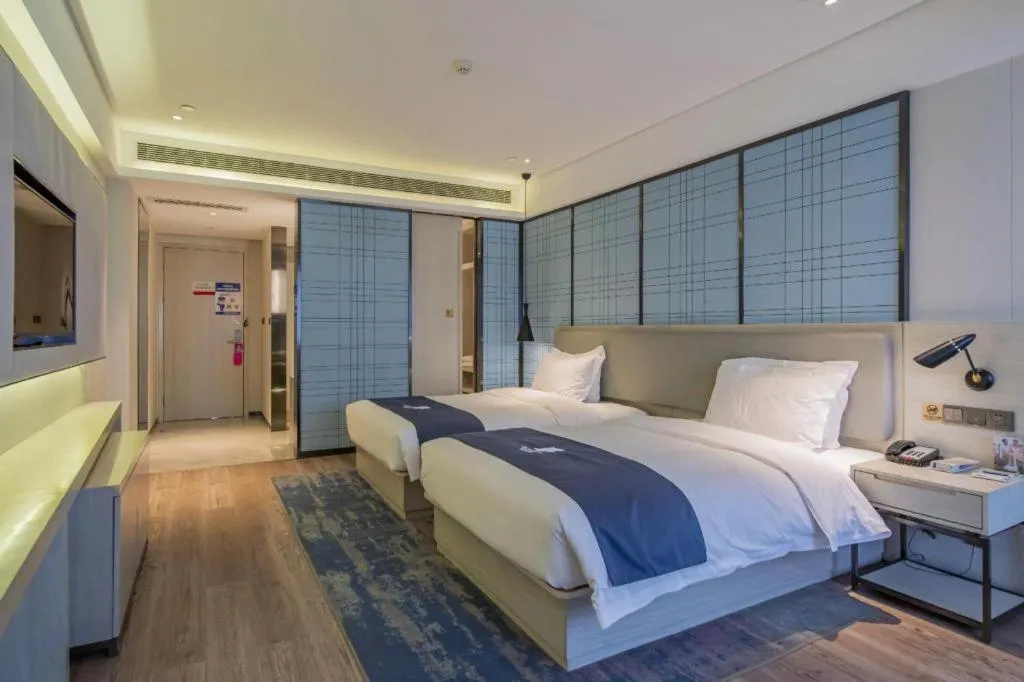 Bed in Echarm Hotel Changsha Guihua Park Metro Station