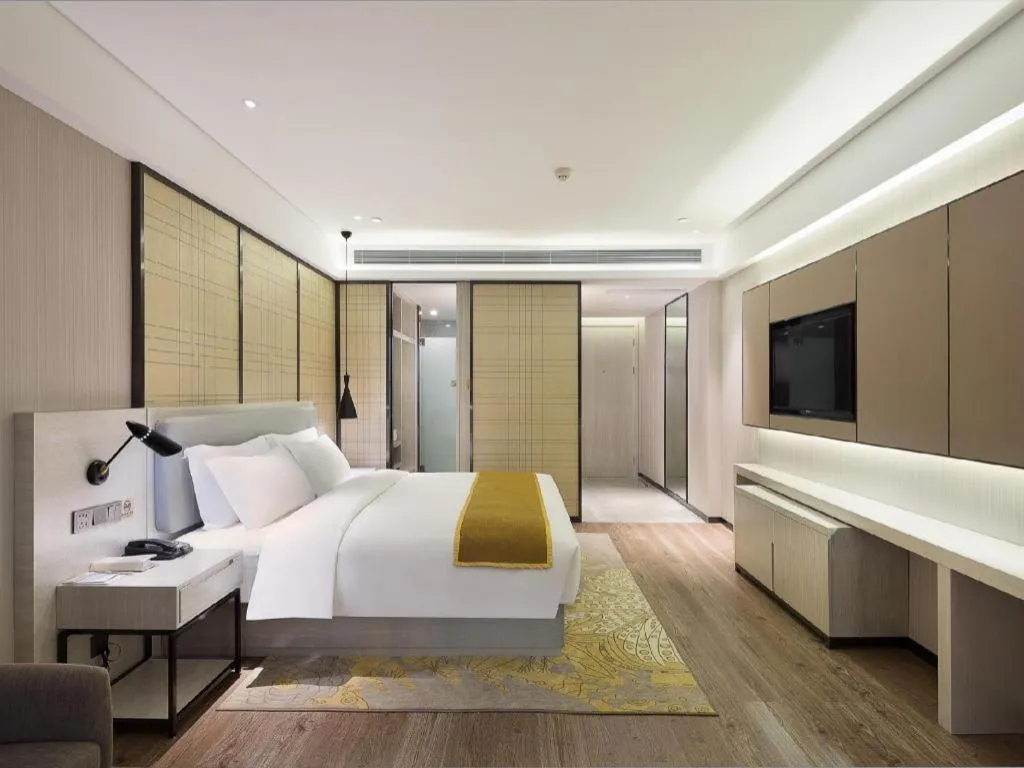 Bed in Echarm Hotel Changsha Guihua Park Metro Station