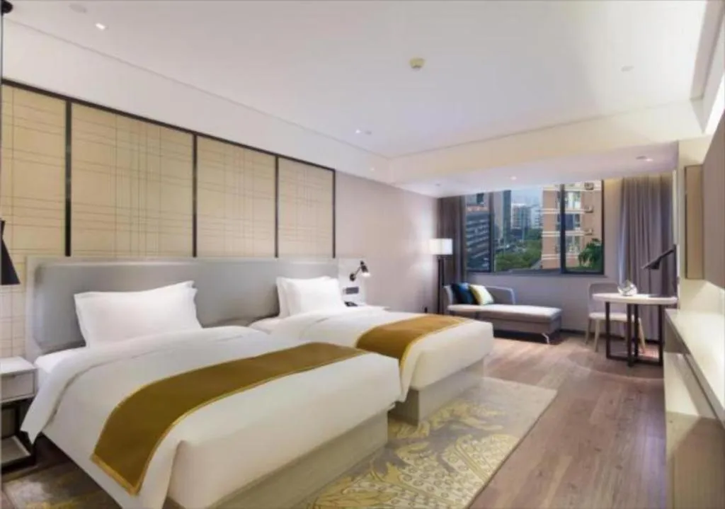 Bed in Echarm Hotel Changsha Guihua Park Metro Station