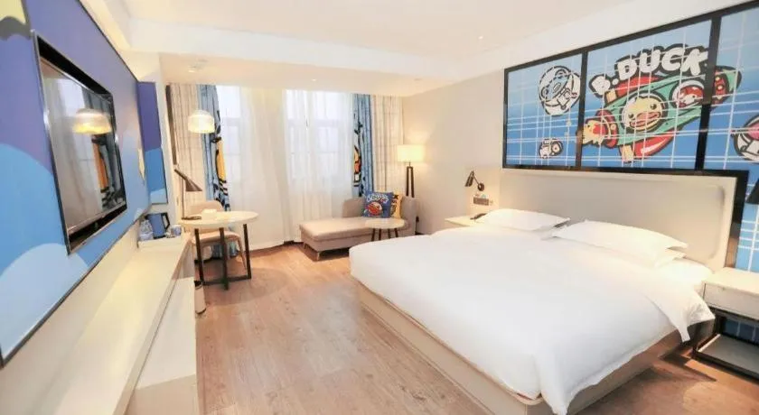 Bed in Echarm Hotel Changsha Guihua Park Metro Station