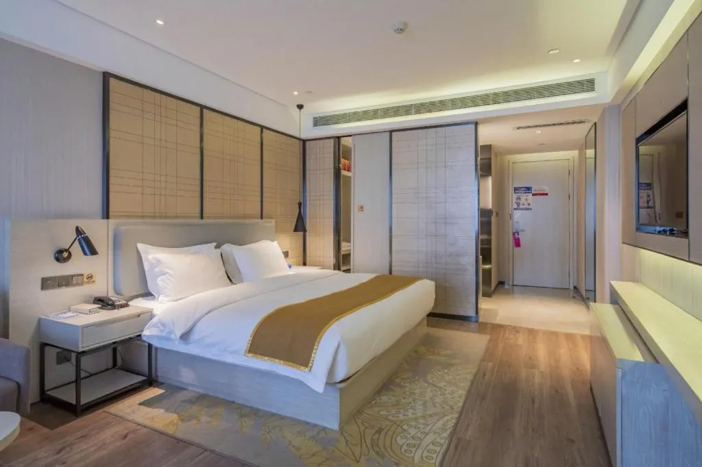 Bed in Echarm Hotel Changsha Guihua Park Metro Station