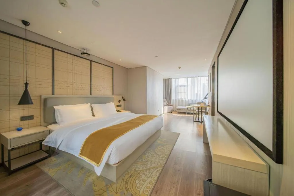 Bed in Echarm Hotel Changsha Guihua Park Metro Station