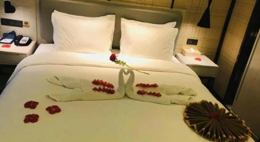 Bed in Echarm Hotel Changsha Guihua Park Metro Station