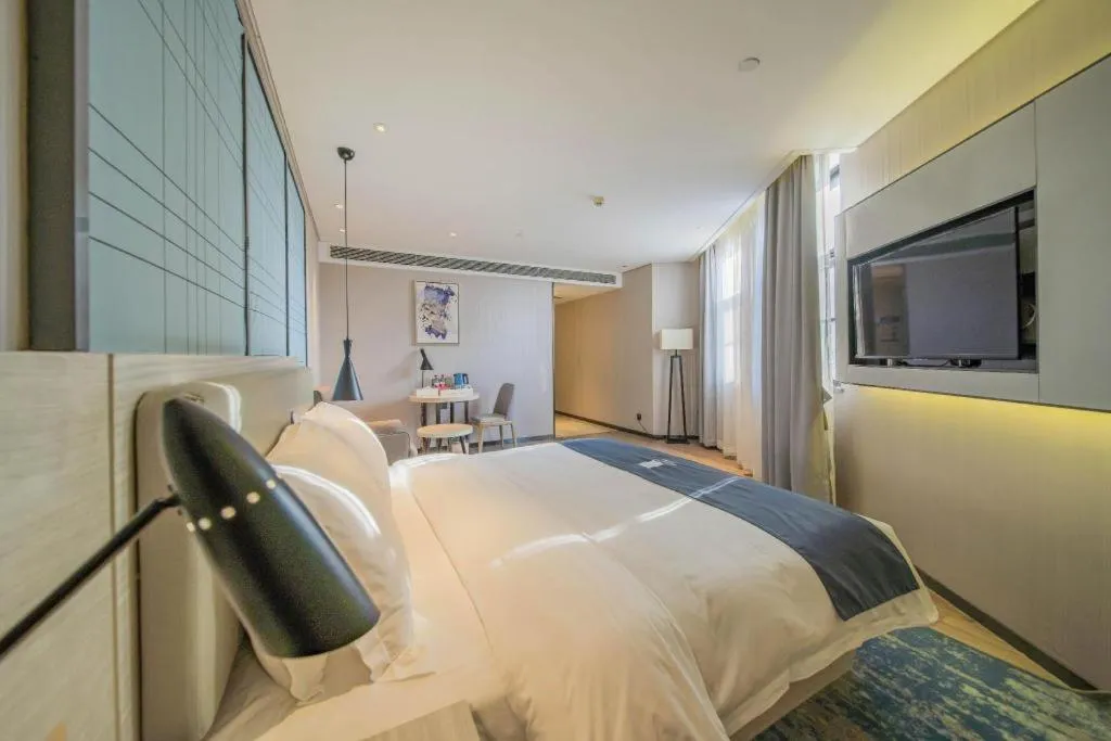 Bed in Echarm Hotel Changsha Guihua Park Metro Station