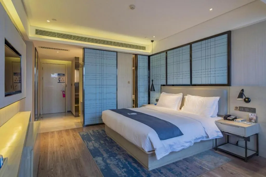 Bed in Echarm Hotel Changsha Guihua Park Metro Station
