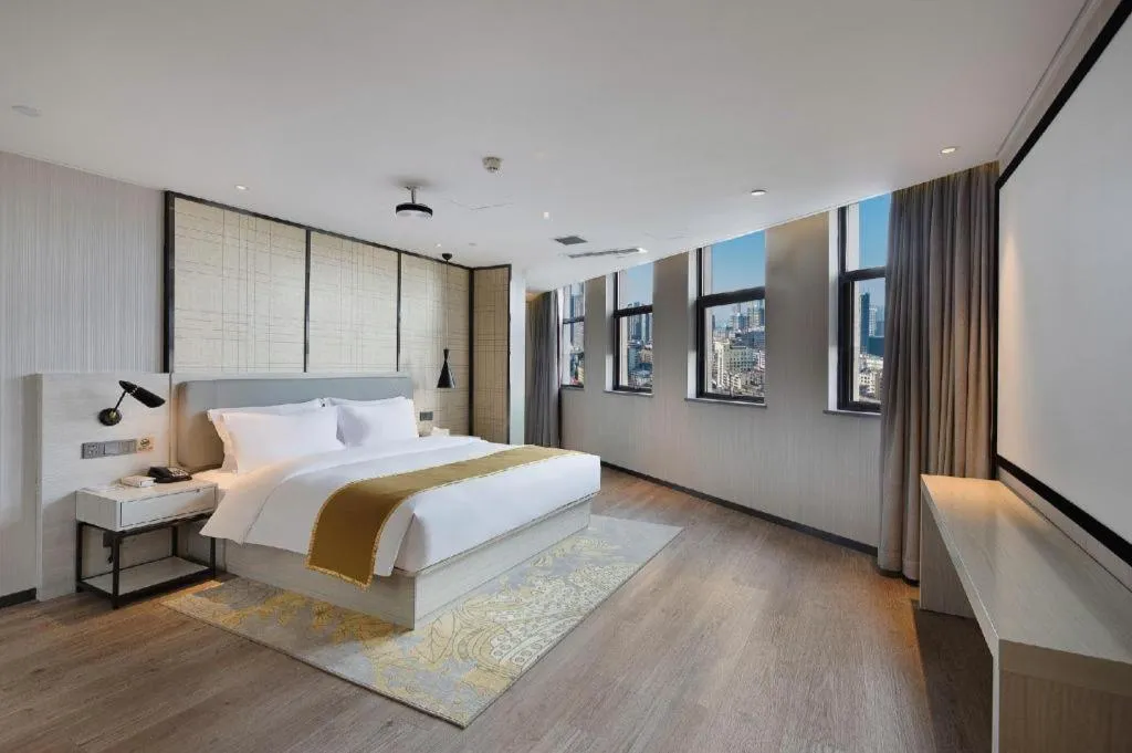 Bed in Echarm Hotel Changsha Guihua Park Metro Station