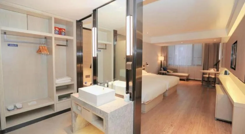 Bed in Echarm Hotel Changsha Guihua Park Metro Station