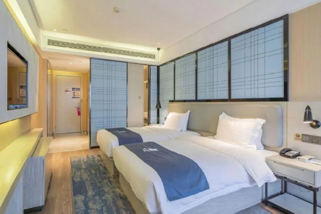 Bed in Echarm Hotel Changsha Guihua Park Metro Station