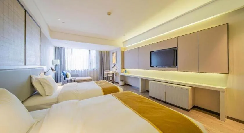 Bed in Echarm Hotel Changsha Guihua Park Metro Station